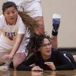 Easts Jayla Jordan, left, and Barrows Caitlyn Brower, center, and Justine Balanza scramble for the loose ball at the Princess Cruises Capital City Classic at Juneau-Douglas High School on Thursday, Dec. 27, 2018. (Michael Penn | Juneau Empire)