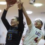 Easts Kimora Nicdao fouls Barrows Katelyn Kaleak at the Princess Cruises Capital City Classic at Juneau-Douglas High School on Thursday, Dec. 27, 2018. (Michael Penn | Juneau Empire)