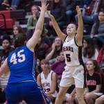 Juneau-Douglas Kiana Potter shoots over Sitkas Jessica Davis at the Princess Cruises Capital City Classic at Juneau-Douglas High School on Thursday, Dec. 27, 2018. Juneau-Douglas won 52-25. (Michael Penn | Juneau Empire)