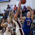 Juneau-Douglas Caitlin Pusich, center, blocks a shot by Sitkas Makenna Smith at the Princess Cruises Capital City Classic at Juneau-Douglas High School on Thursday, Dec. 27, 2018. Juneau-Douglas won 52-25. (Michael Penn | Juneau Empire)