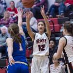 Juneau-Douglas Trinity Jackson shoots over Sitkas Tawny Smith at the Princess Cruises Capital City Classic at Juneau-Douglas High School on Thursday, Dec. 27, 2018. Juneau-Douglas won 52-25. (Michael Penn | Juneau Empire)