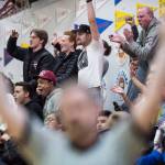 Former Juneau-Douglas players and fans celebrate a three-point shot against Lathrop at the Princess Cruises Capital City Classic at Juneau-Douglas High School on Thursday, Dec. 27, 2018. Juneau-Douglas won 69-45. (Michael Penn | Juneau Empire)