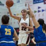 Juneau-Douglas Caitlin Pusich passes to a teammate against Barrow at the Princess Cruises Capital City Classic at Juneau-Douglas High School on Friday, Dec. 28, 2018. (Michael Penn | Juneau Empire)