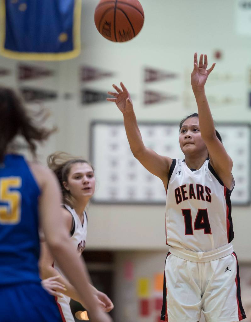 Juneau-Douglas Alyxn Bohulano takes a three-point shot against Barrow at the Princess Cruises Capital City Classic at Juneau-Douglas High School on Friday, Dec. 28, 2018. (Michael Penn | Juneau Empire)