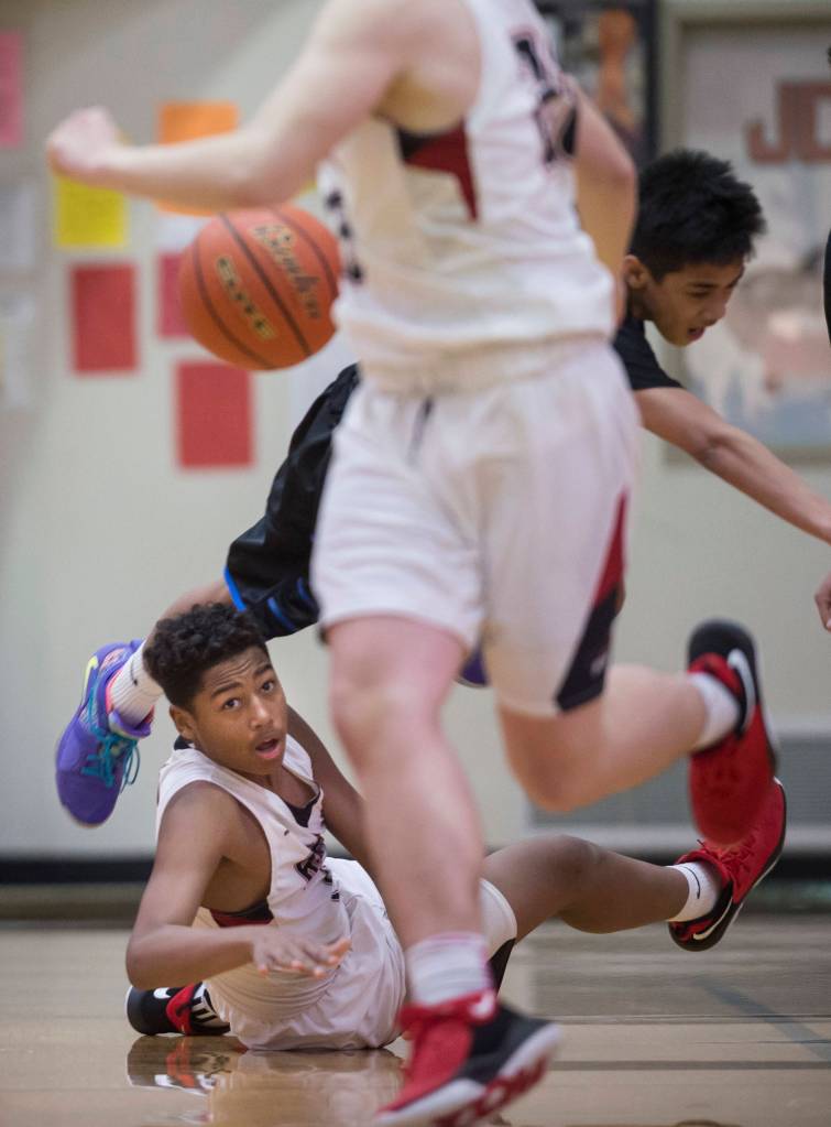 Juneau-Douglas Malakai Nichols gets a pass off to a teammate against Barrows at the Princess Cruises Capital City Classic at Juneau-Douglas High School on Friday, Dec. 28, 2018. Juneau-Douglas won 68-63. (Michael Penn | Juneau Empire)