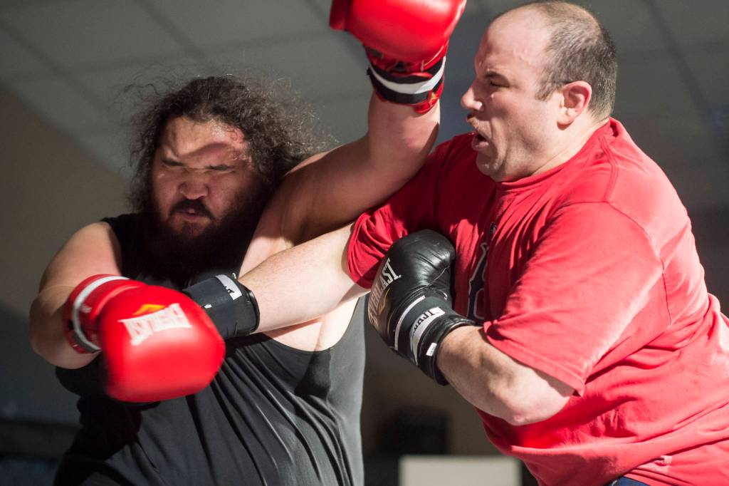 Michael Pitaro, right, takes on James Roberts at the Beatdown #33 at the Elizabeth Peratrovich Hall on Friday, Dec. 28, 2018. Pitaro won the match. (Michael Penn | Juneau Empire)