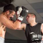 Brian Lauth, dark shirt, takes on Fritz Ropati in the main event at the Beatdown #33 at the Elizabeth Peratrovich Hall on Friday, Dec. 28, 2018. Lauth won the match. (Michael Penn | Juneau Empire)