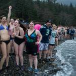 Swimmers wait with excitement before the 24th annual Polar Bear Dip at the Auke Village Recreation Area on Friday, Jan. 1, 2016. (Michael Penn | Juneau Empire File)