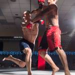 Terrence Wheat, left, charges Jose Rodriquez during their MMA fight at the Beatdown 33 at the Elizabeth Peratrovich Hall on Friday, Dec. 28, 2018. Wheat won the match. (Michael Penn | Juneau Empire)