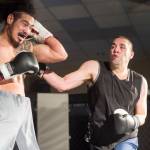 Brian Lauth, right, connects on Fritz Ropati in the main event at the Beatdown 33 at the Elizabeth Peratrovich Hall on Friday, Dec. 28, 2018. Lauth won the match. (Michael Penn | Juneau Empire)