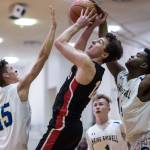 Juneau-Douglas Brock McCormick, center, is blocked by Maine-Endwells Jordan Gallagher, left, and Kameron Griggs at the Princess Cruises Capital City Classic at Juneau-Douglas High School on Saturday, Dec. 29, 2018. Juneau-Douglas won 66-61. (Michael Penn | Juneau Empire)