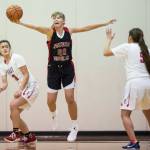 Juneau-Douglas Caitlin Pusich, center, intercepts the ball between Easts Fua Filoialii, left, and Jayla Jordan at the Princess Cruises Capital City Classic at Juneau-Douglas High School on Saturday, Dec. 29, 2018. East won 57-55. (Michael Penn | Juneau Empire)