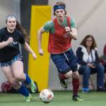 Grinch Gang, red, competes against Black Ice, black, in the finals of the senior division at the annual Holiday Cup Soccer Tournament at the Wells Fargo Dimond Park Field House on Monday, Dec. 31, 2018. The Grinch Gang won 8-2. (Michael Penn | Juneau Empire)