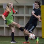 Grinch Gang, red, competes against Black Ice, black, in the finals of the senior division at the annual Holiday Cup Soccer Tournament at the Wells Fargo Dimond Park Field House on Monday, Dec. 31, 2018. The Grinch Gang won 8-2. (Michael Penn | Juneau Empire)