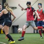 Grinch Gang, red, competes against Black Ice, black, in the finals of the senior division at the annual Holiday Cup Soccer Tournament at the Wells Fargo Dimond Park Field House on Monday, Dec. 31, 2018. The Grinch Gang won 8-2. (Michael Penn | Juneau Empire)
