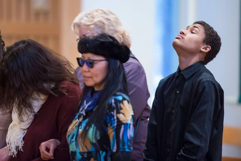 Juneau residents listen to the Benediction at the end of the Dr. Martin Luther King Jr. 2019 Community Celebration at St. Pauls Catholic Church on Monday, Jan. 21, 2019. (Michael Penn | Juneau Empire)