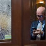 Rep. Jonathan Kreiss-Tomkins, D-Sitka, steps out of the House chambers to use his cell phone on the opening day of the 31st Session of the Alaska Legislature on Tuesday, Jan. 15, 2019. (Michael Penn | Juneau Empire)