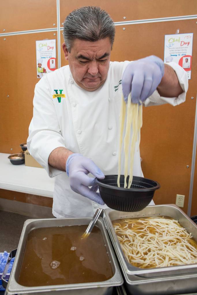 Chef Matt Little Dog prepares a bowl of authentic Japanese ramen at Floyd Dryden Middle School as part of Chefs Day on Friday, Jan. 18, 2019. The Anchorage chefs visiting the Juneau and Sitka School Districts to introduced new and healthy foods via performance cooking demonstrations. (Michael Penn | Juneau Empire)