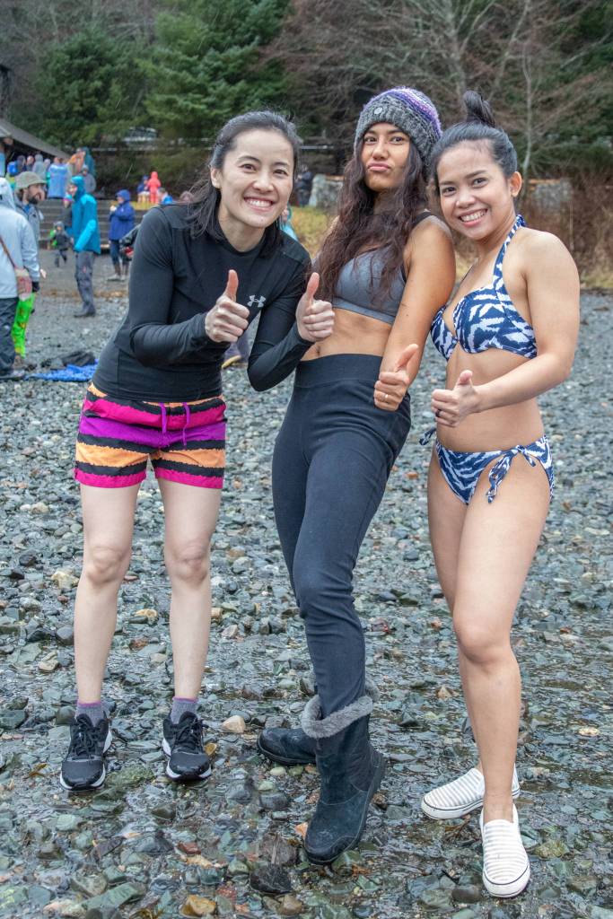 Jan. 6, 2019: What do you wear to the Polar Bear Dip when it is 40 degrees, raining and windy? Anything you want! These three women were ready to go on New Years Day. Fang Sukkamol wore an Under Armour long-sleeve black shirt and North Face multi-colored running shorts. Kip Fenton opted for black leggings, a gray jog bra and a gray and purple beanie, while Oat Cummings sported an InGear blue and white tiger bikini. All three were ready for an invigorating beginning to 2019!