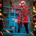 Dec. 23, 2018: Tis the season to enjoy the holidays in style. As part of an annual decorating tradition, Santas helper Mary Siroky recently assisted in hanging holiday lights at the Gitkov dock in Auke Bay. Her stylish outfit includes a requisite Santas hat, red jacket, red scarf and black pants and boots. And although her clothes were not tarnished with ashes or soot, she was wearing her requisite OSHA safety belt as she was hoisted into the air.