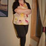 Nov. 18, 2018: On a dark and gray Friday in November, Nanci Chisholm was a definite bright spot. On her feet all day at work, she knows how to dress for both comfort and style. This day she wore Black Pixie ankle pants from Old Navy, an Ann Taylor multi-color empire waist blouse, a black shrug from The Dress Barn and Clarks wedge sandals, which she says are comfortable inside year-round.