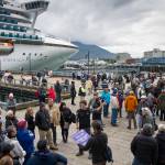 Cruise ship visitors gather for their tours on the Seawalk on Wednesday, Sept. 13, 2017. (Michael Penn | Juneau Empire)