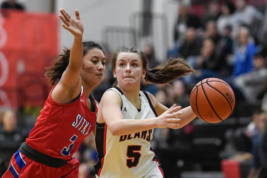 Juneau-Douglas Kiana Potter, right, drives against Sitkas Tiffany Elefante at JDHS on Friday, Jan. 25, 2019. Sitka won 37-31. (Michael Penn | Juneau Empire)
