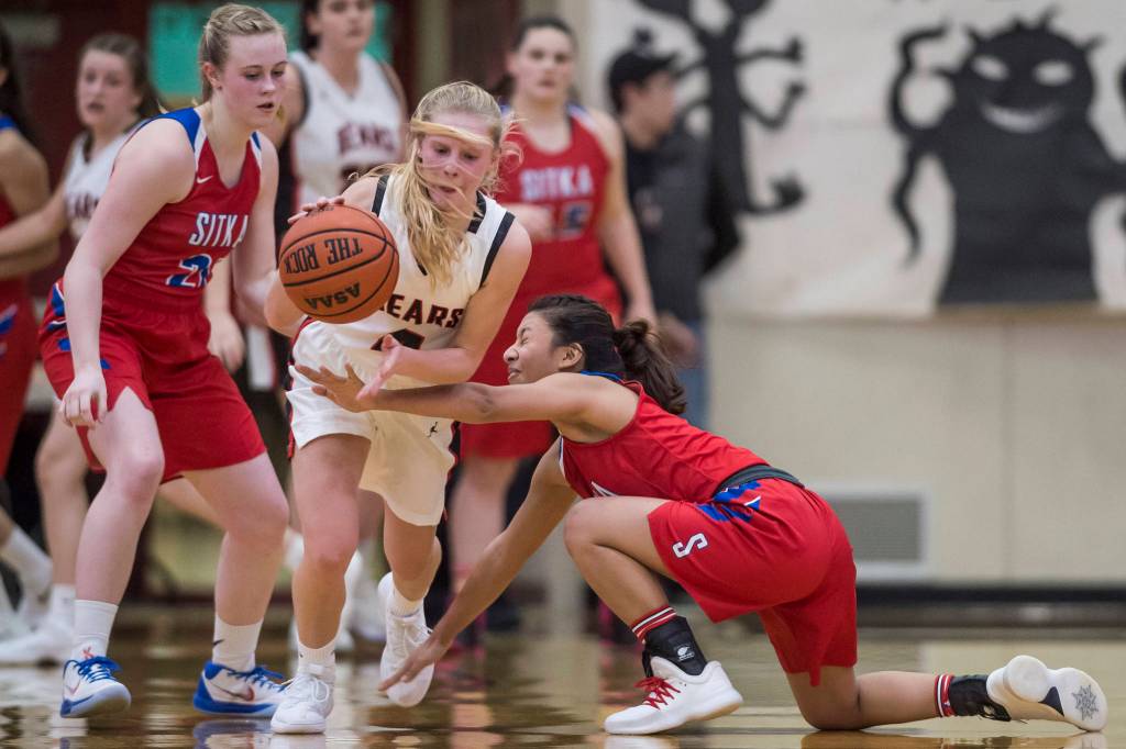 Juneau-Douglas Sadie Tuckwood, center, steals the ball against Sitkas Tiffany Elefante, right, at JDHS on Friday, Jan. 25, 2019. Sitka won 37-31. (Michael Penn | Juneau Empire)
