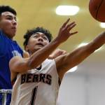 Juneau-Douglas Israel Yadao has his shot blocked by Thunder Mountains Bryson Echiverri at JDHS on Friday, Jan. 25, 2019. Thunder Mountain won 67-63. (Michael Penn | Juneau Empire)