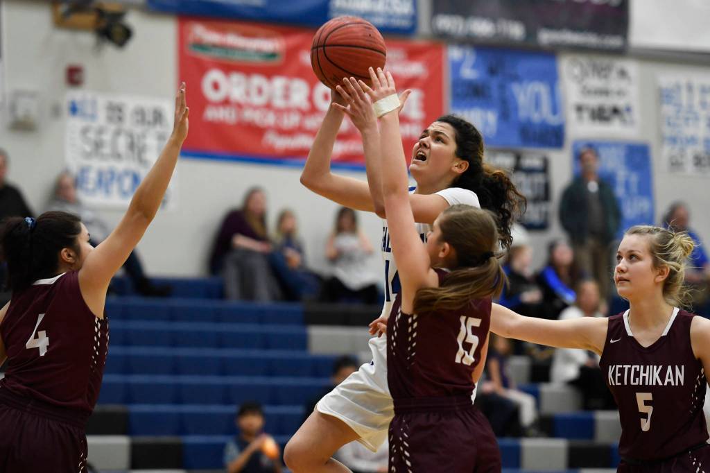 Thunder Mountains Charlee Lewis shoots against Ketchikans Lianne Guevarra, left, Madison Rose, center, and Emmie Smith at TMHS on Friday, Jan. 25, 2019. Ketchikan won 42-36. (Michael Penn | Juneau Empire)