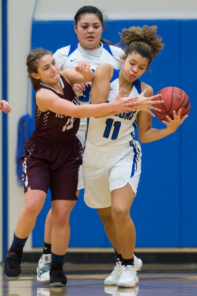 Thunder Mountains Tzadi Hauck, right, steals the ball away from Ketchikans Madison Rose at TMHS on Friday, Jan. 25, 2019. Ketchikan won 42-36. (Michael Penn | Juneau Empire)