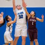 Thunder Mountains Nina Fenumiai, center, rebound against Ketchikans Shaelynn Mendoza at TMHS on Friday, Jan. 25, 2019. Ketchikan won 42-36. (Michael Penn | Juneau Empire)