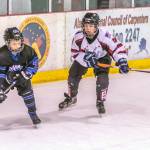 Juneaus Camden Kovach chases down Eagle Rivers Adam Kara during a weekend series at Treadwell Arena. (Courtesy Photo | Steve Quinn)
