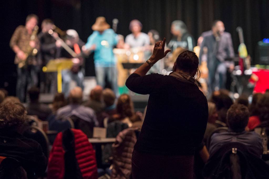 An audience member dances to Khu.eex at Centennial Hall on Monday, Jan. 28, 2019. (Michael Penn | Juneau Empire)