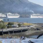The Norwegian Pearl cruise ship, right, pulls into the AJ Dock in Juneau in September 2018. (Michael Penn | Juneau Empire)