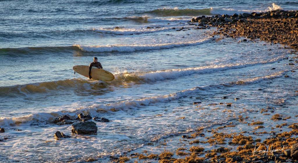 A surfer calls it a day at the sun sets at the Shrine of St. Therese on Jan. 6, 2019. (Courtesy Photo | Kerry Howard)