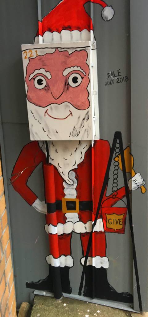 Santa covers an outdoor utility box just outside the doors to Pie in the Sky in downtown Juneau. (Courtesy Photo | Denise Carroll)
