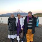 Susan Stark Christianson stands with Rika and Yoshimaru Higa at a gathering of indigenous people in Japan that furthered Christiansons progress on a documentary film. Christianson was able to make the trip thanks to a fellowship award and $18,000 from the Rasmuson Foundation. Christianson was one of several local artists who earned an award and financial support from the foundation in 2018. (Courtesy photo | Susan Stark Christianson)