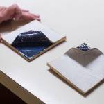 Glo Ramirez shows off her artwork, including these folded tiles, at her Juneau apartment on Monday, Dec. 31, 2018. (Michael Penn | Capital City Weekly)