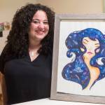 Glo Ramirez shows off her artwork at her Juneau apartment on Monday, Dec. 31, 2018. (Michael Penn | Capital City Weekly)