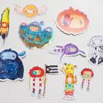 Glo Ramirez shows off her artwork, including these monster stickers, at her Juneau apartment on Monday, Dec. 31, 2018. (Michael Penn | Capital City Weekly)