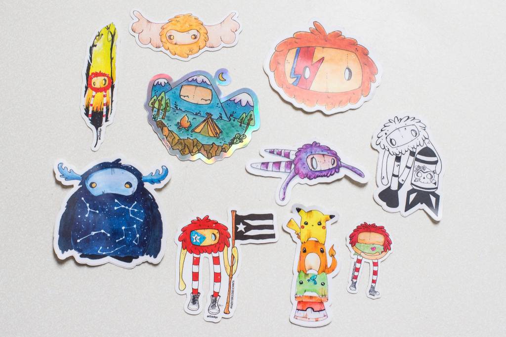 Glo Ramirez shows off her artwork, including these monster stickers, at her Juneau apartment on Monday, Dec. 31, 2018. (Michael Penn | Capital City Weekly)