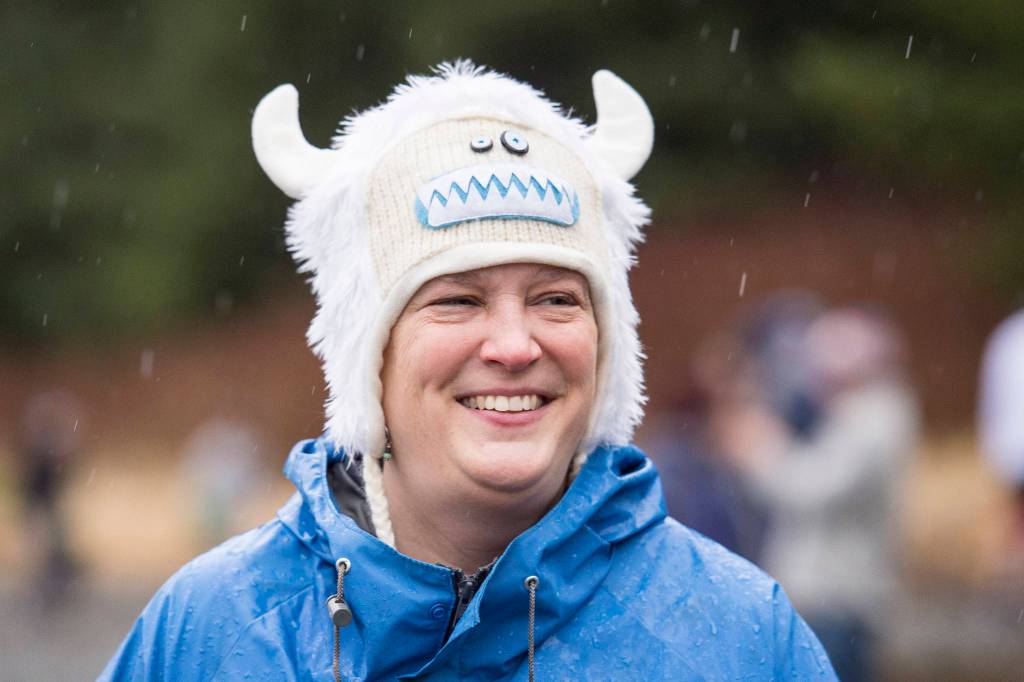 Teri Rasmussen sports a troll hat to fend off the rain before taking to the frigid waters at Auke Bay Recreation Area for the annual Juneau Polar Bear Dip on Tuesday, Jan. 1, 2019. Nearly 200 people took the plunge to start off the new year. (Michael Penn | Juneau Empire)