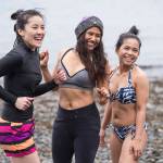 Juneau residents prepare themselves for the annual Juneau Polar Bear Dip at Auke Bay Recreation Area on Tuesday, Jan. 1, 2019. Nearly 200 people took the plunge to start off the new year. (Michael Penn | Juneau Empire)