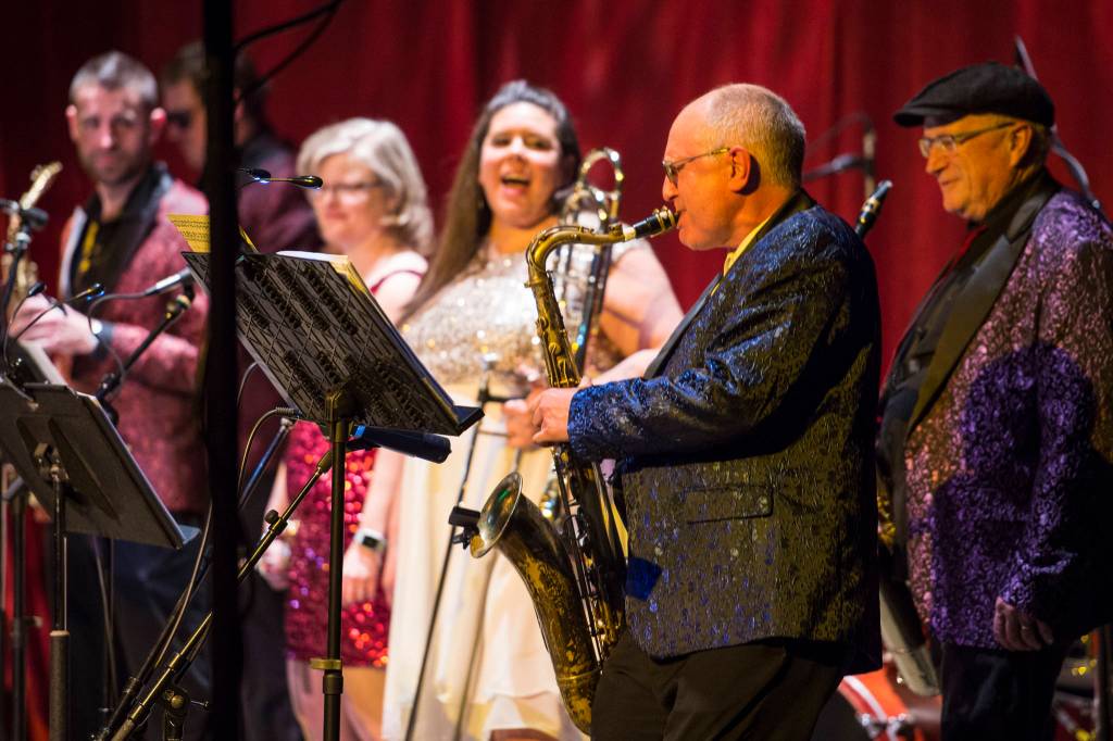 Saxophonist Doug Bridges performs a solo with the Gamble & High Costa Livin during the New Years Eve Gala at Centennial Hall on Monday, Dec. 31, 2018. The event was a fundraiser for the Juneau Arts and Humanities Council and Juneau Jazz & Classics. (Michael Penn | Juneau Empire)