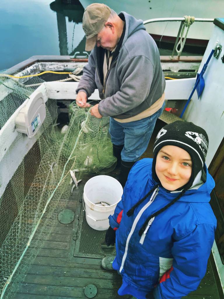 Jackson Pearson fishes for smelt with his grandfather. (Courtesy Photo | Vivian Faith Prescott)
