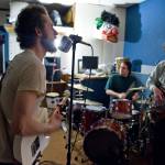 Nickolas Wagner, drums, left, George Kuhar, guitar and lead vocals, Jason Messing, drums and Simon Taylor, bass, right, of Playboy Spaceship rehearse Tuesday. Not shown is Bridget Cross Kuhar, keyboards. (Michael Penn | Juneau Empire File)