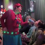 Amy Dressel provides Elle McPherson with a shot of whipped cream during intermission at the Christmas extravaganza at the Gold Town Theater Saturday, Jan. 5, 2019. (Ben Hohenstatt | Capital City Weekly)