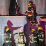 Juneau Capital City Fire/Rescue firefighters work a building fire at North Franklin and Second Street on Monday, April 16, 2017.