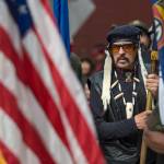 Wayne Smallwood lines up with the Southeast Alaska Native Veterans honor guard to lead dance groups parade through downtown Juneau on Saturday, June 9, 2018, the last day of Celebration 2018. (Michael Penn | Juneau Empire)